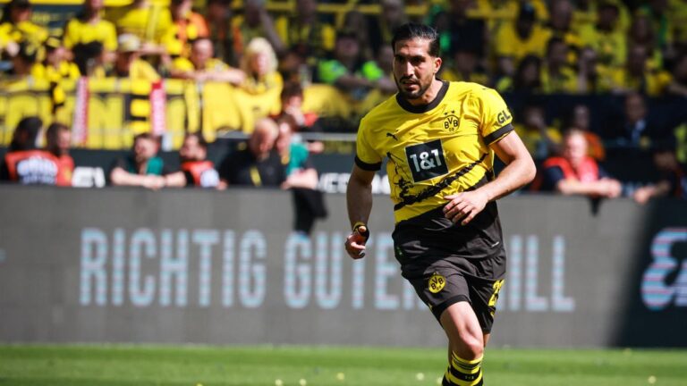 Borussia Dortmund shields Emre Can