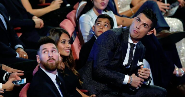 Cristiano Ronaldo tackles Lionel Messi