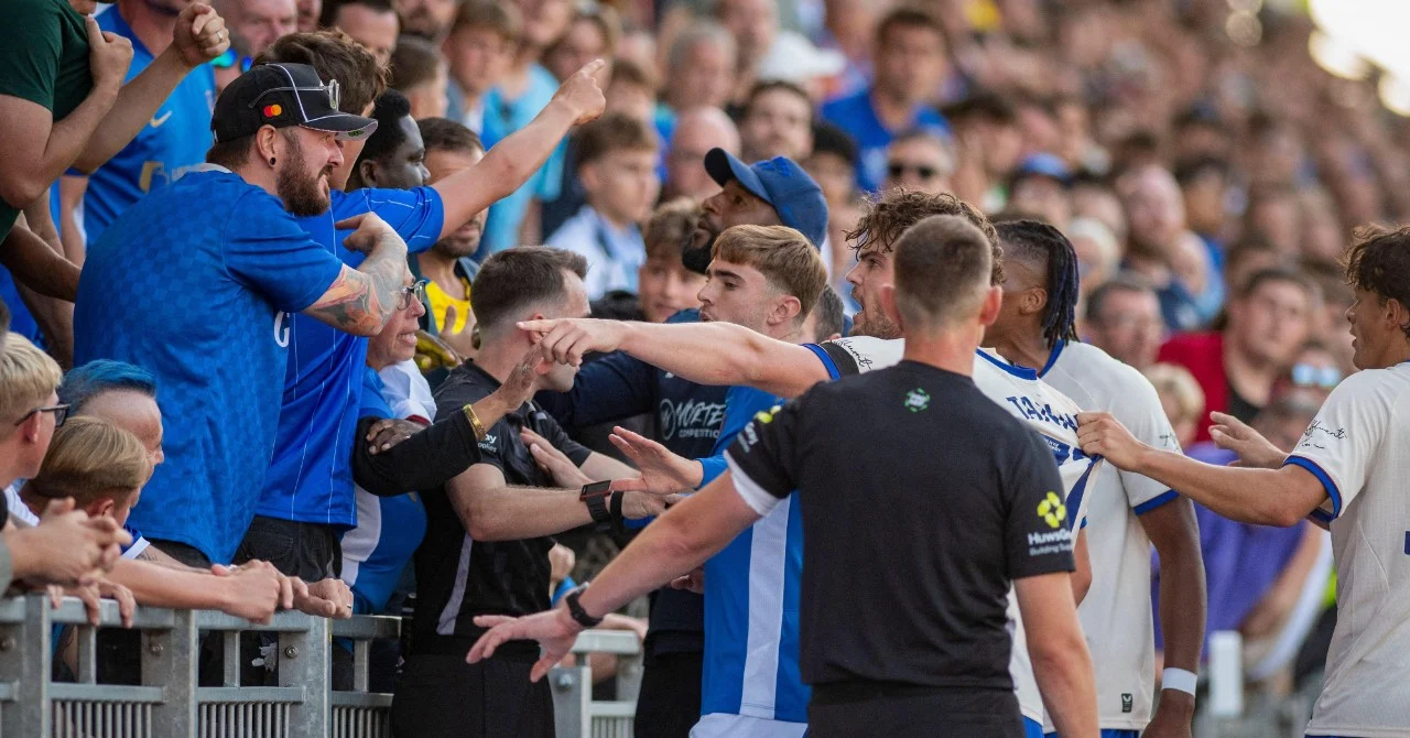 Shocking scene: A footballer attacks a kid in the stands